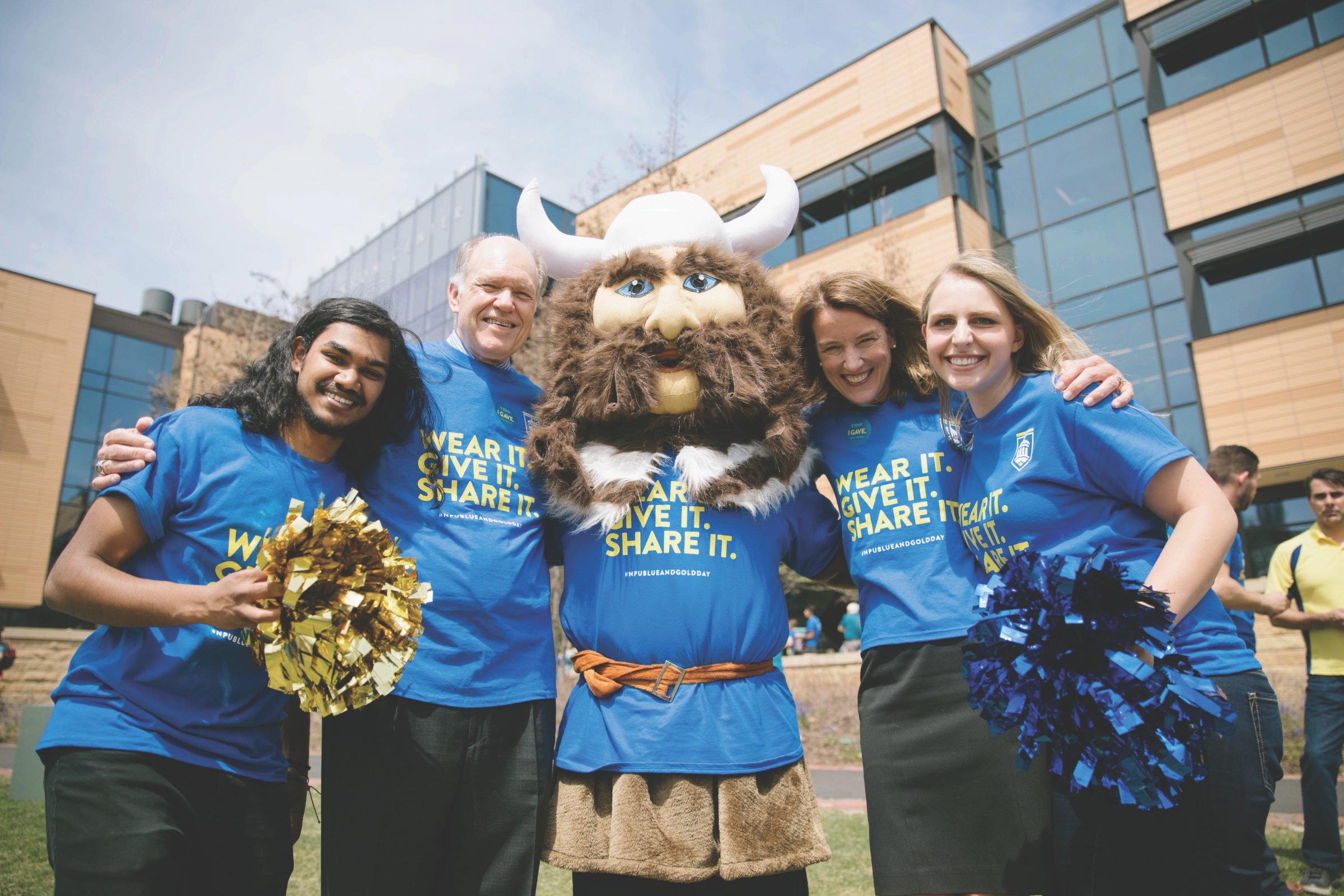 Interim President Carl E. Balsam and newly elected North Park President Mary K. Surridge celebrate with students and Ragnar the Viking, the student body mascot.