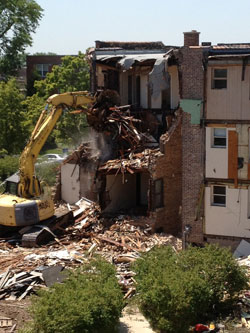 Demolition of campus apartments on Christiana Avenue prepares the way for the new Johnson Center for Science and Community Life.