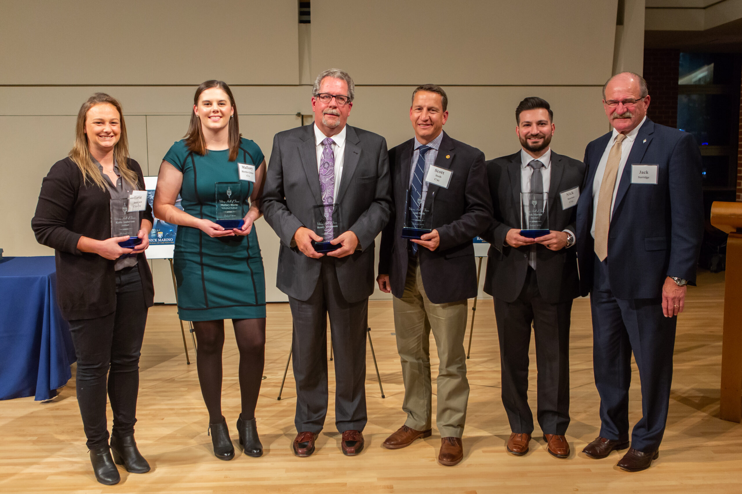 Katie Anderson C’12 G’15, Mallory Bieritz-Gelzer C’12, Randy Youngman C’77, Scott Steib C’93, and Nick Marino C’10 are inducted into the Viking Hall of Fame by Athletic Director Dr. Jack Surridge.