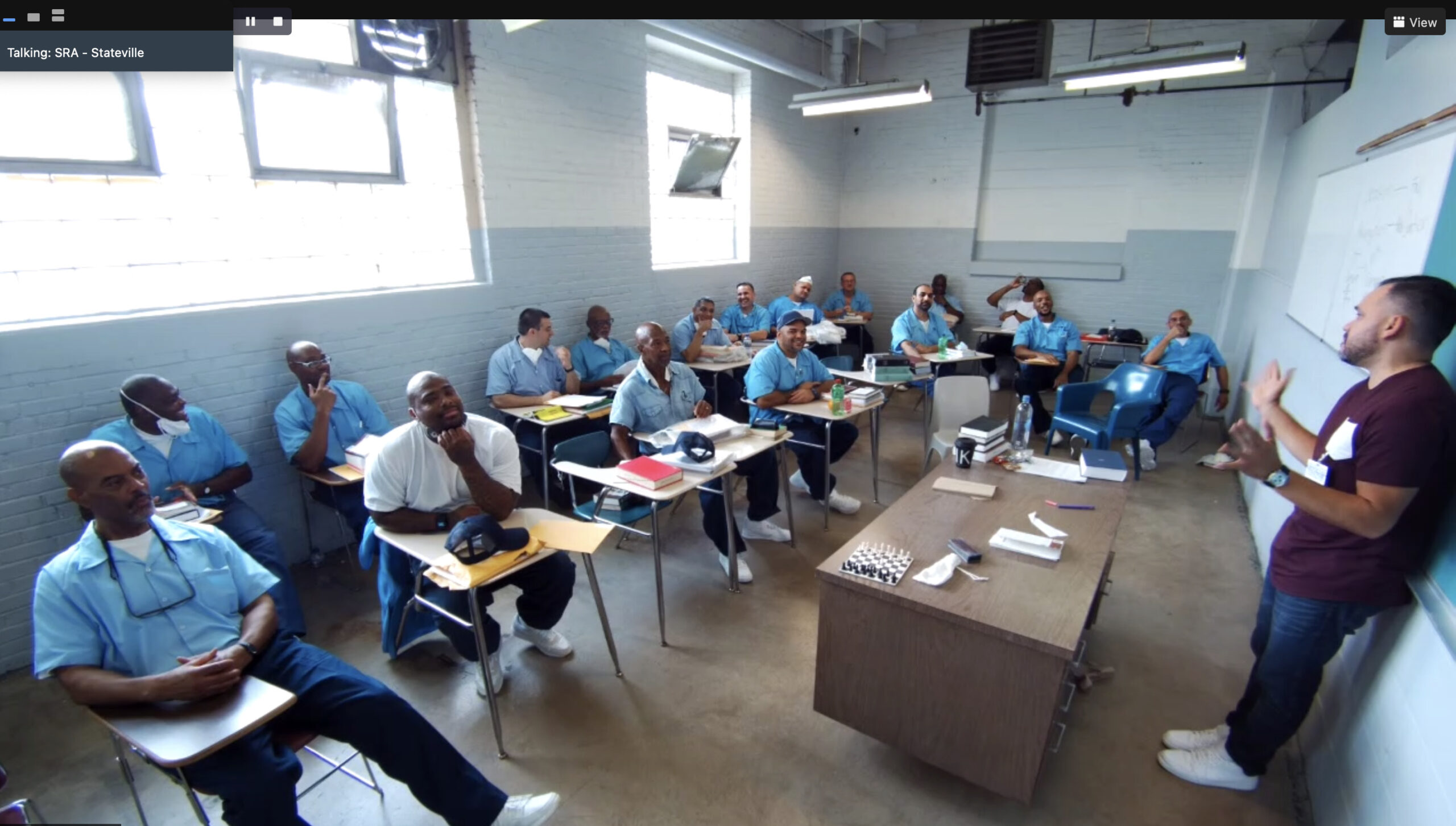 men in Stateville sitting in a classroom learning