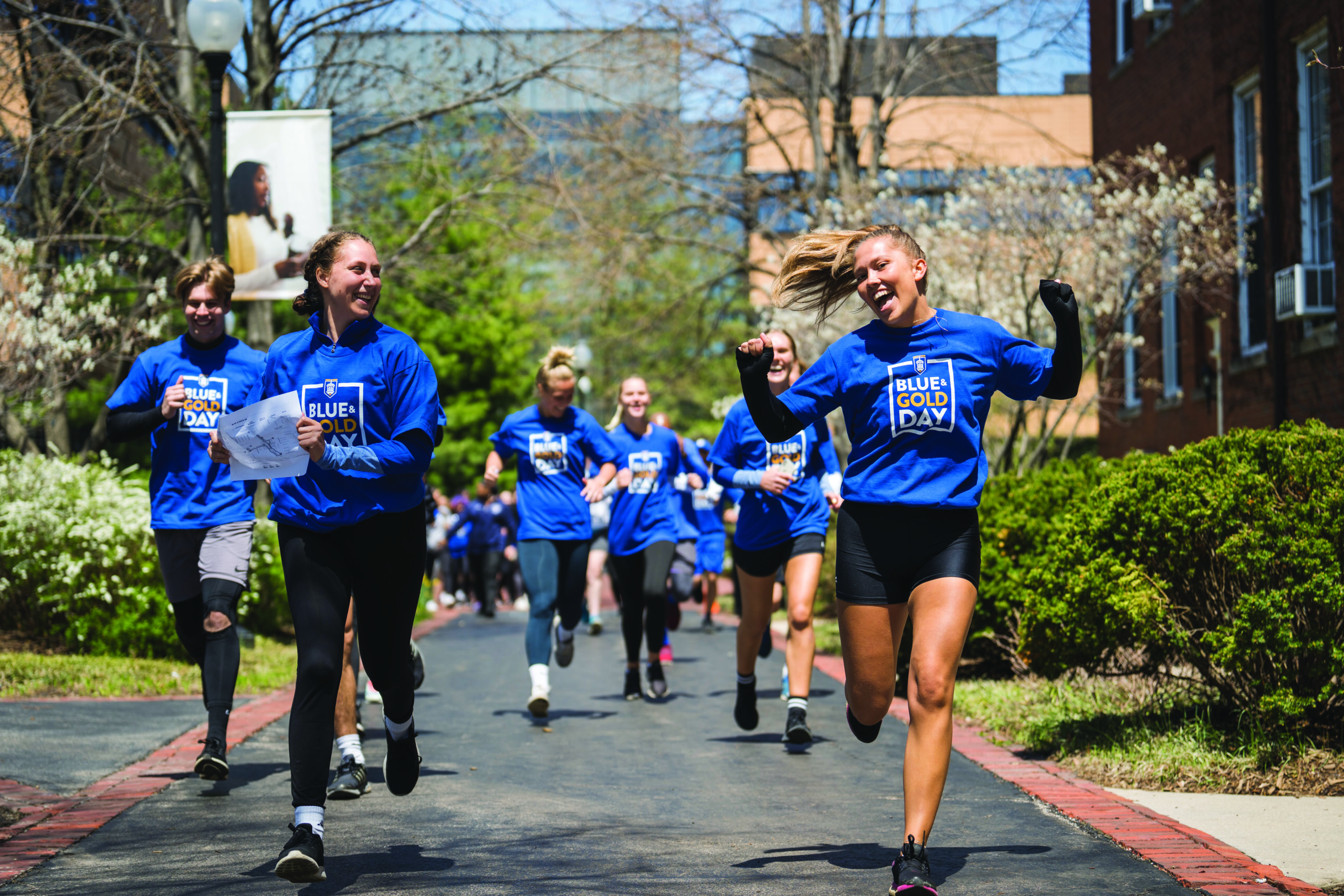 Students running at Blue and Gold Day