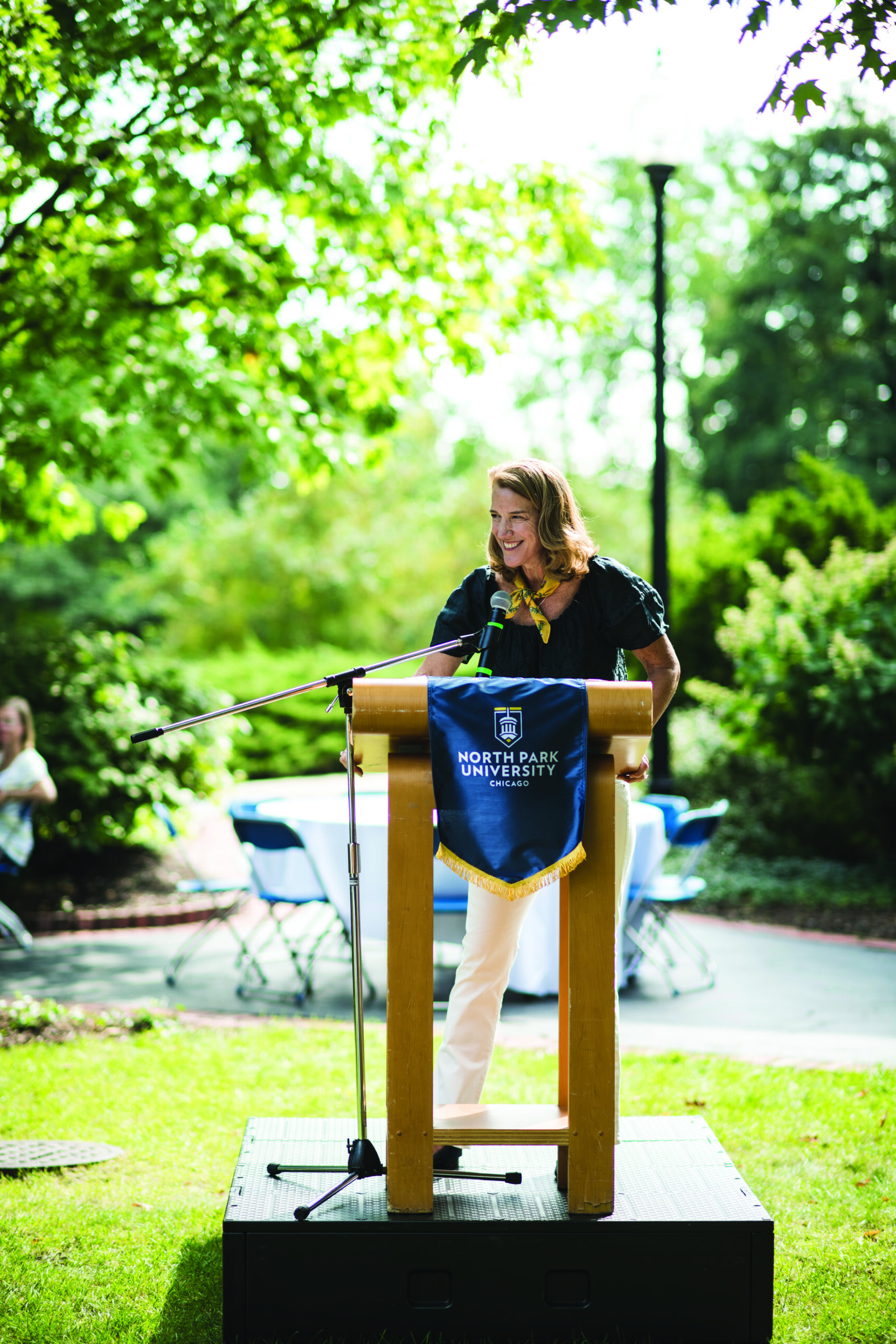 President Surridge giving a speech at a podium