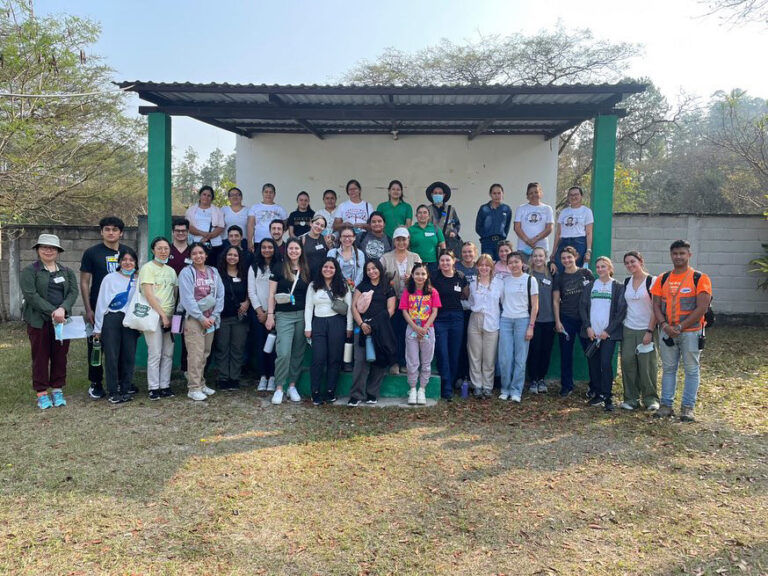 North Park students stand with other Honduran community members during a Global Brigades trip. 